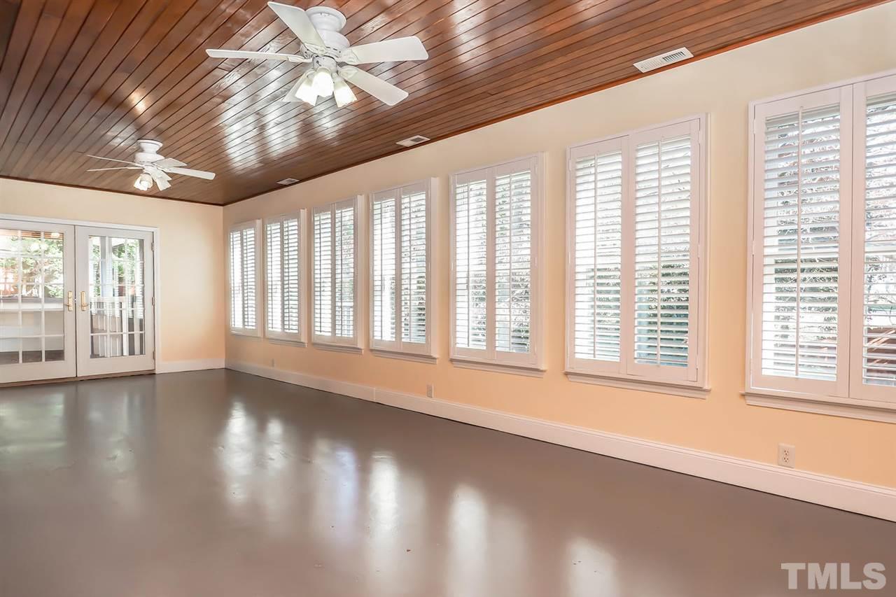 5800 Contour Drive Raleigh, NC 27612 - Photo 12 of 19 a view of an empty room with wooden floor and a window