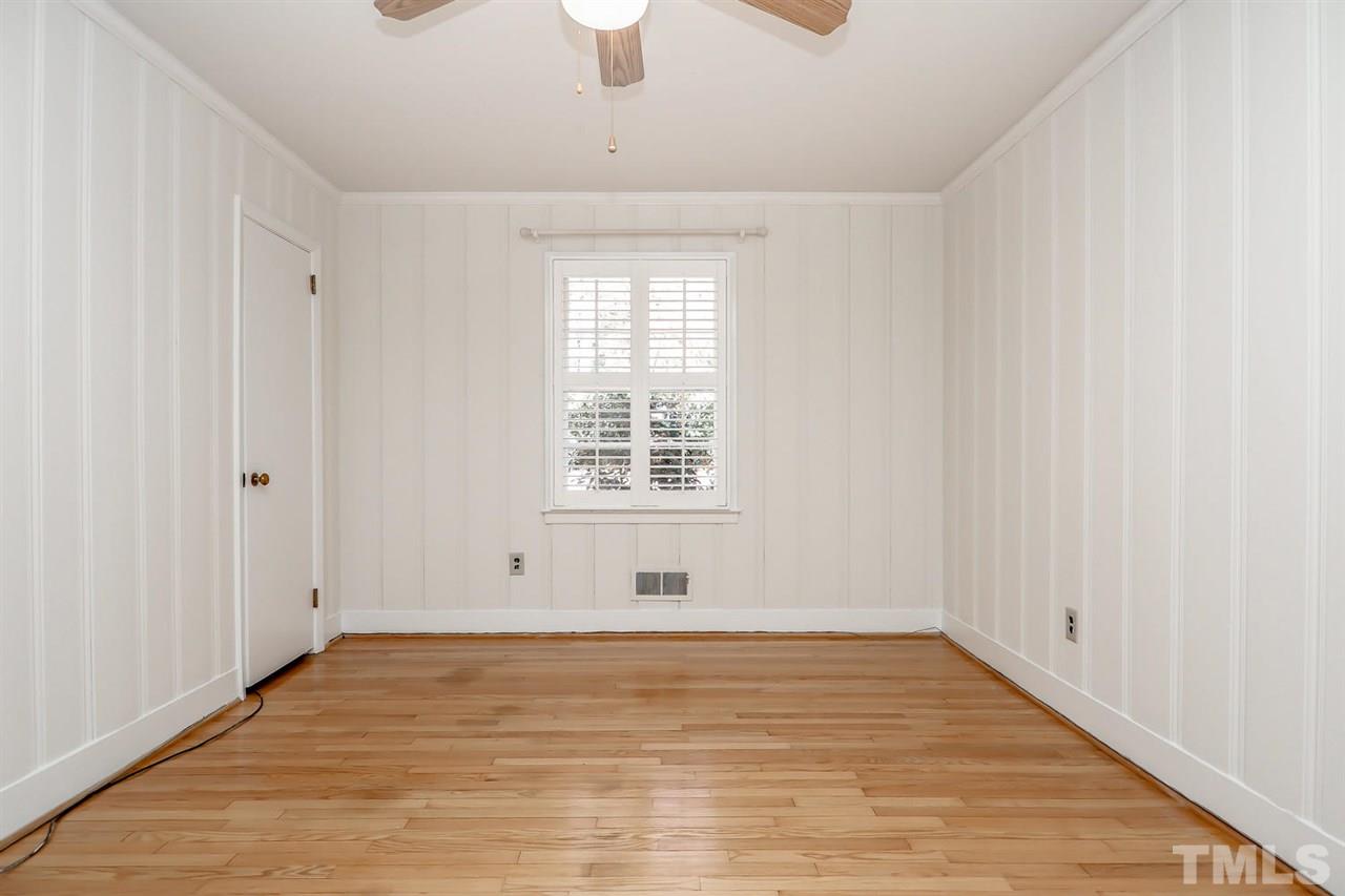 5800 Contour Drive Raleigh, NC 27612 - Photo 15 of 19 a view of empty room with wooden floor and fan
