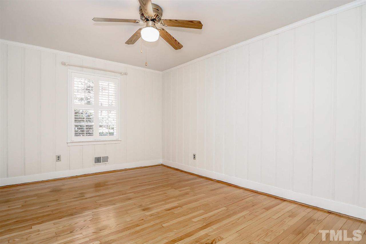 5800 Contour Drive Raleigh, NC 27612 - Photo 16 of 19 wooden floor in an empty room with a window