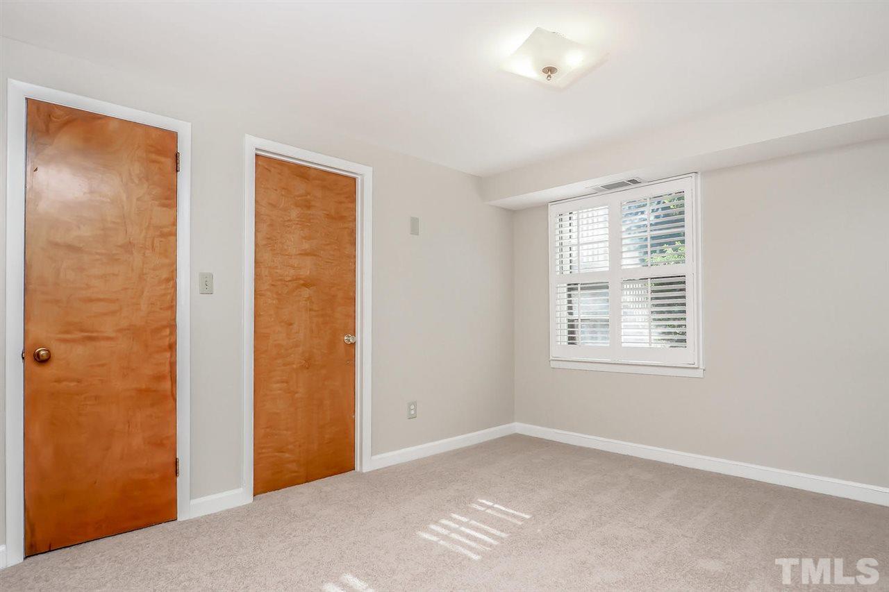 5800 Contour Drive Raleigh, NC 27612 - Photo 17 of 19 a view of an empty room with a window