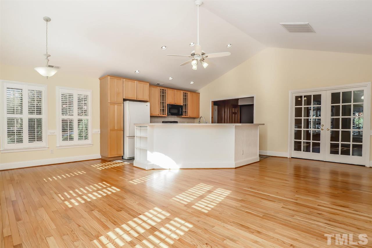 5800 Contour Drive Raleigh, NC 27612 - Photo 9 of 19 a view of a kitchen with wooden floor and a kitchen space
