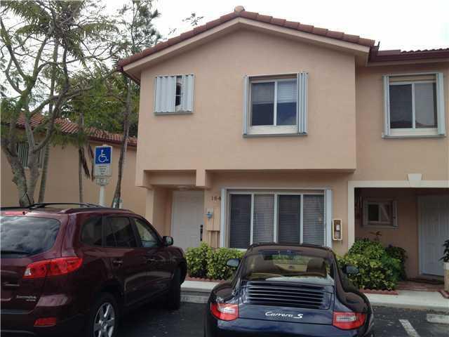 a front view of a house with parking