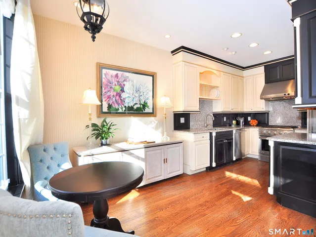 a kitchen with a stove and a refrigerator