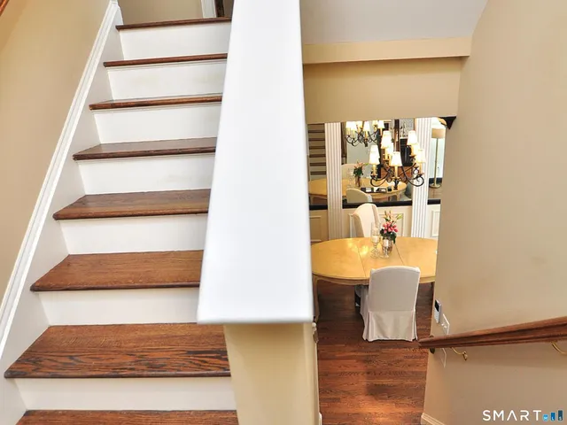 a bedroom with a bed and a lamp on table