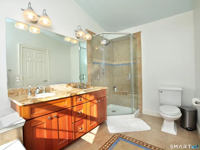 a bathroom with a toilet and a shower curtain
