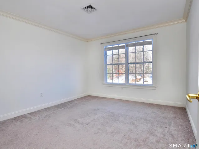 a view of a hallway with washer and dryer