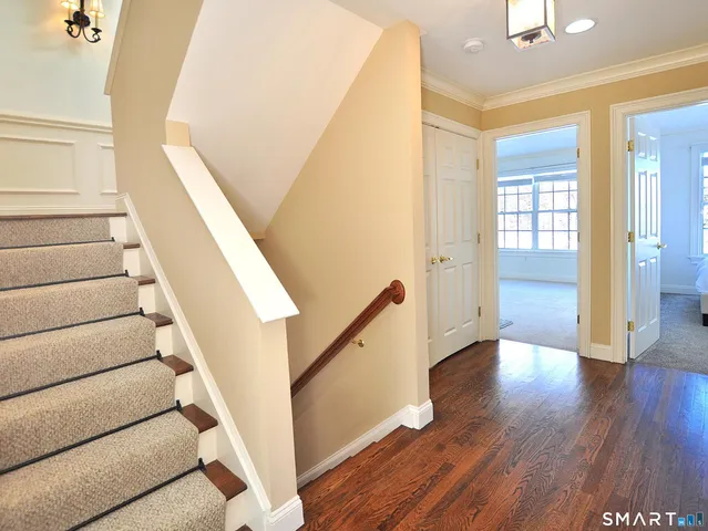 a view of a room with wooden floor