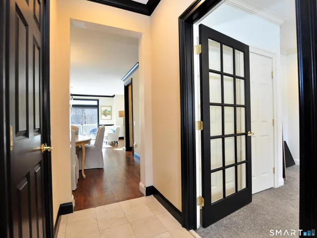 a view of a big room with windows and furniture