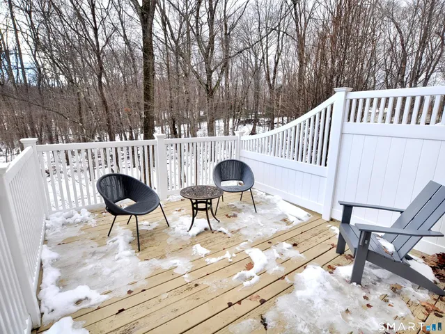 a view of a house with a bench in a yard