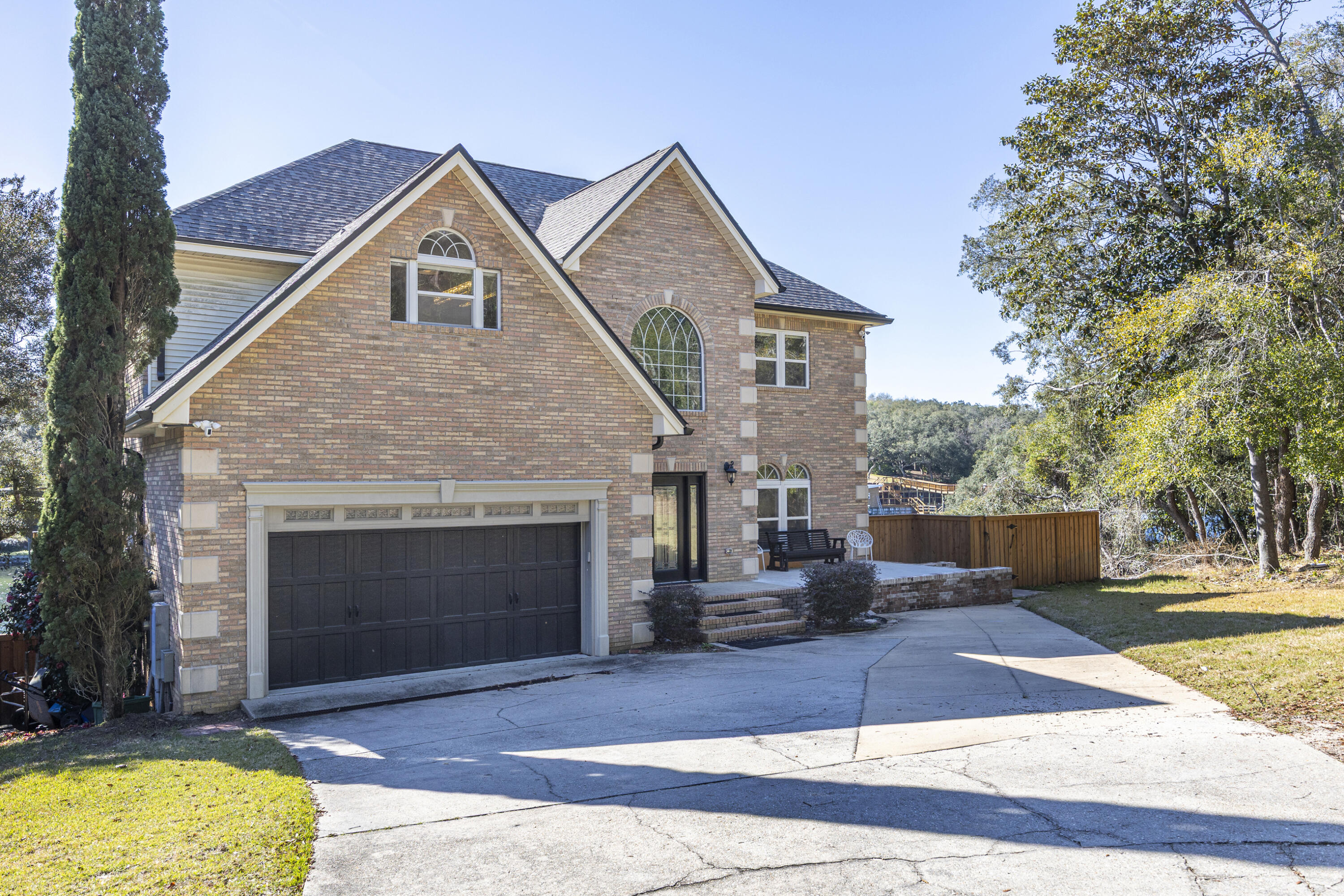 147 Eldredge Road Fort Walton Beach, FL 32547 - Photo 1 of 82 a front view of a house with a yard