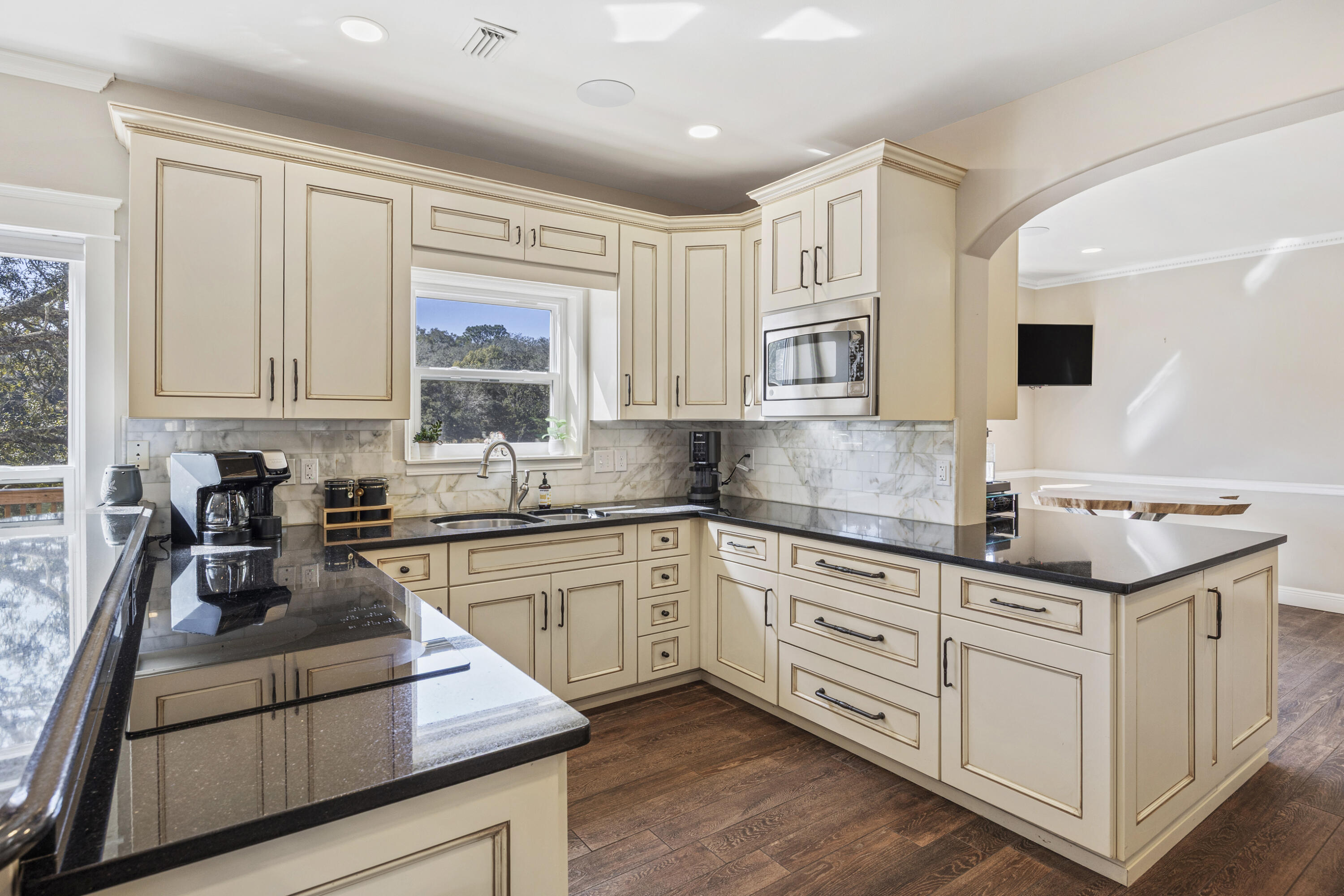 147 Eldredge Road Fort Walton Beach, FL 32547 - Photo 12 of 82 a kitchen with granite countertop white cabinets and white appliances