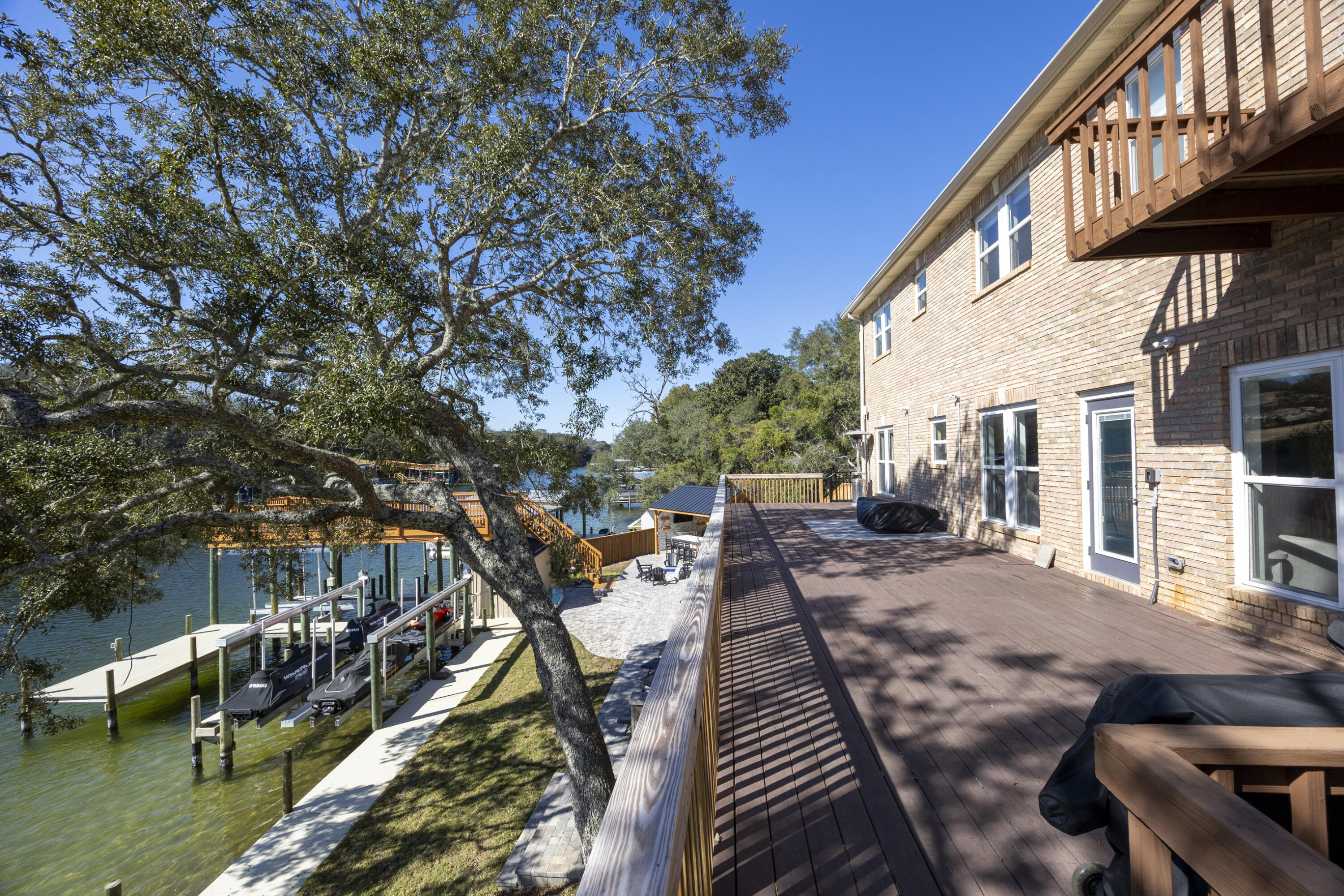 147 Eldredge Road Fort Walton Beach, FL 32547 - Photo 17 of 82 a view of a house with backyard porch and sitting area