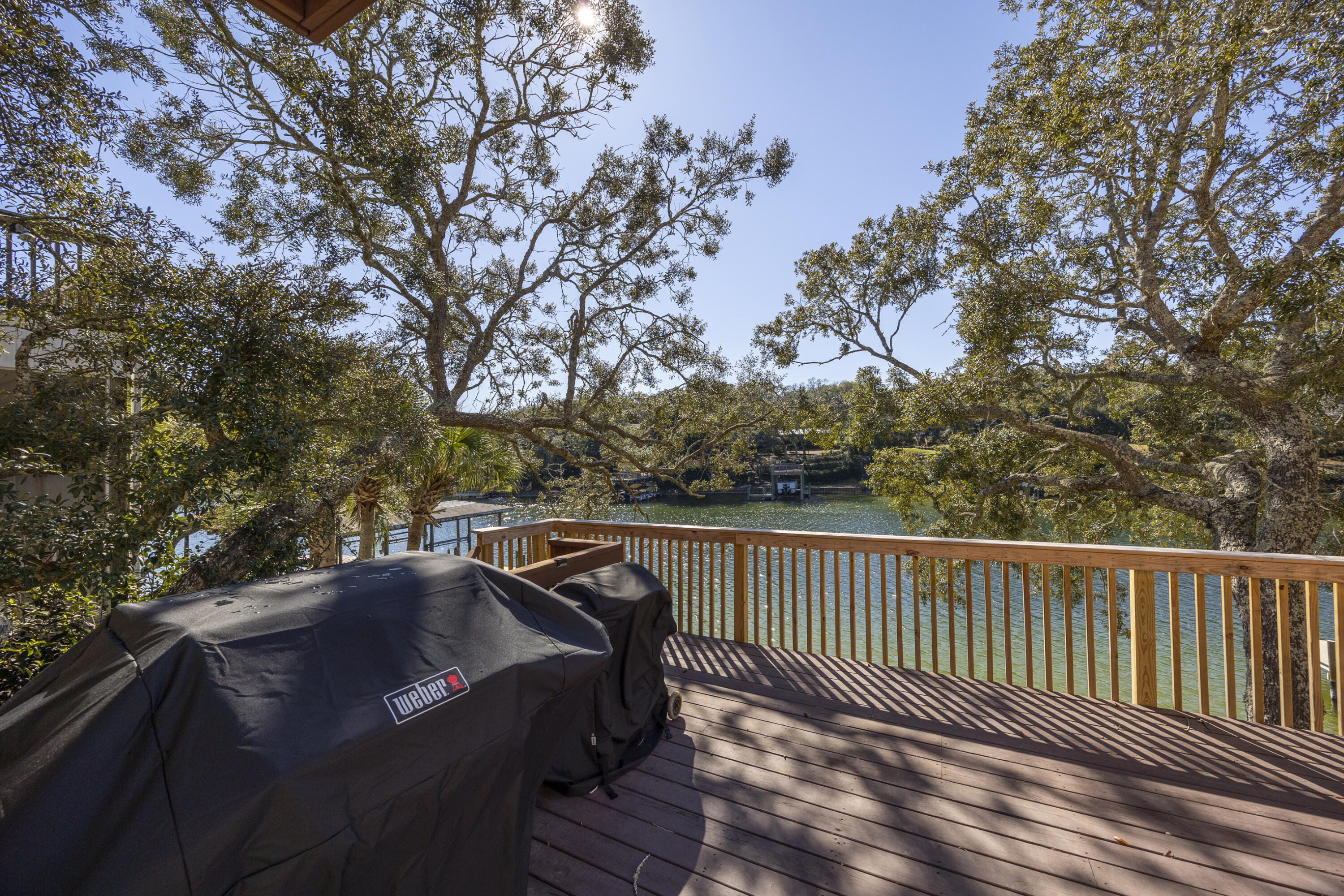 147 Eldredge Road Fort Walton Beach, FL 32547 - Photo 18 of 82 a view of a roof deck with wooden floor and fence