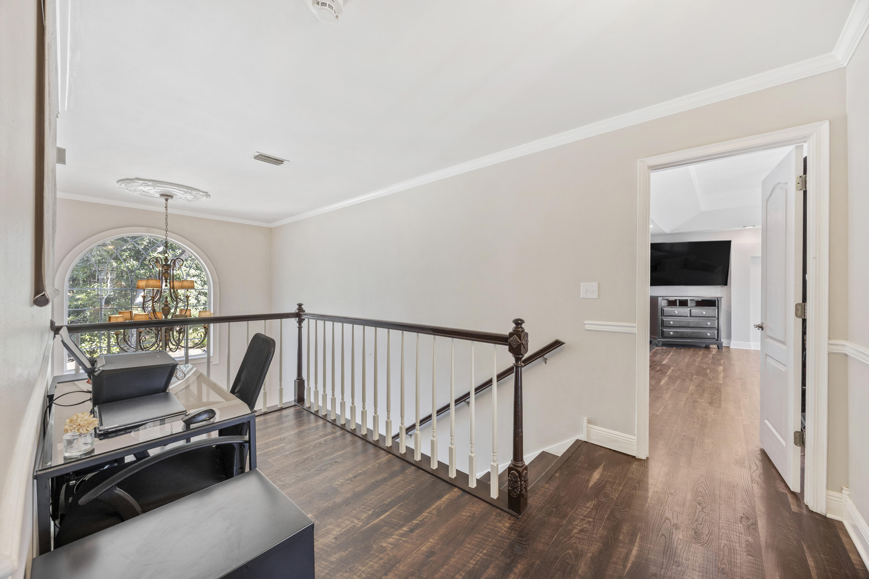 147 Eldredge Road Fort Walton Beach, FL 32547 - Photo 20 of 82 a view of a hallway with wooden floor and staircase