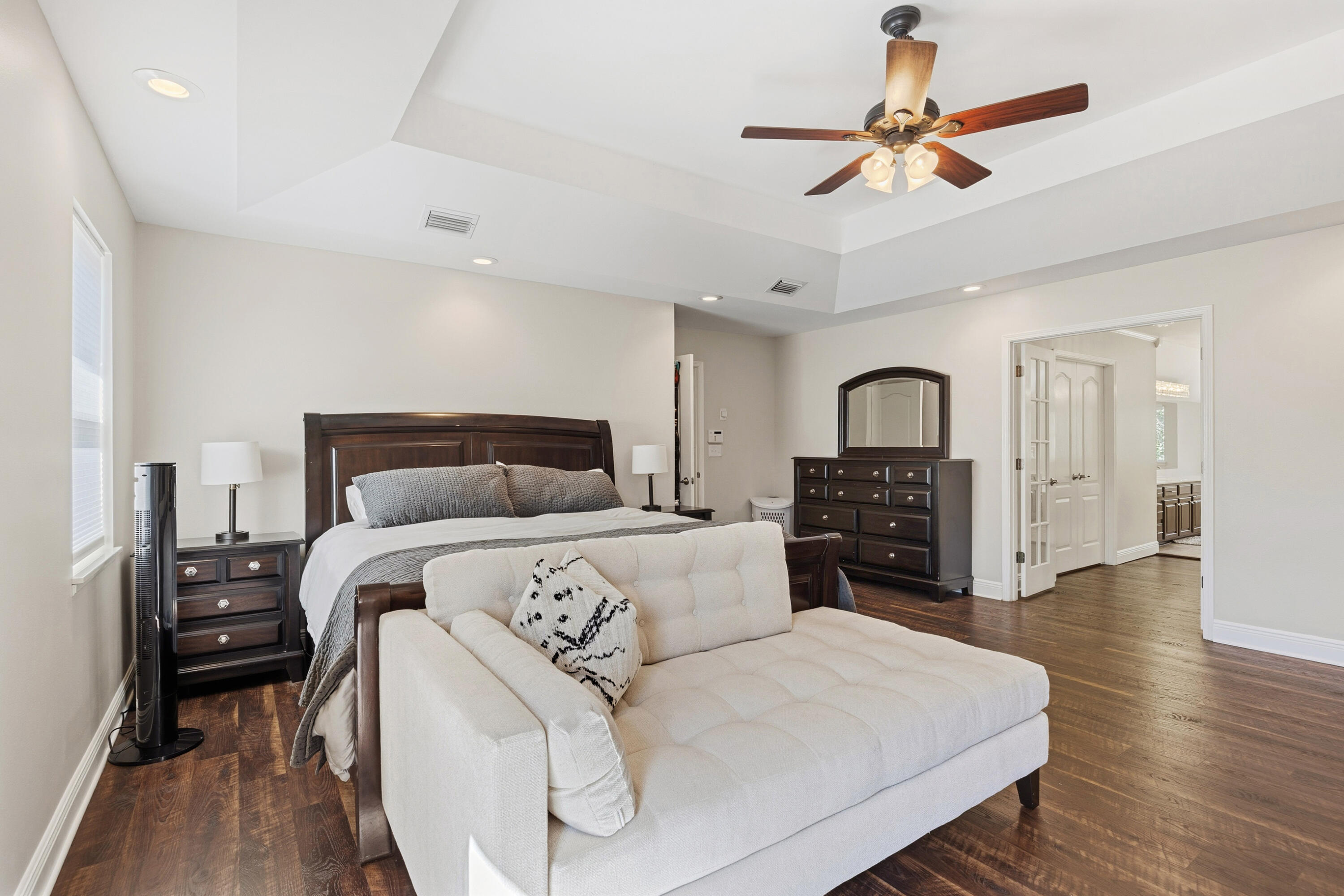 147 Eldredge Road Fort Walton Beach, FL 32547 - Photo 26 of 82 a bedroom with a large bed and a chandelier