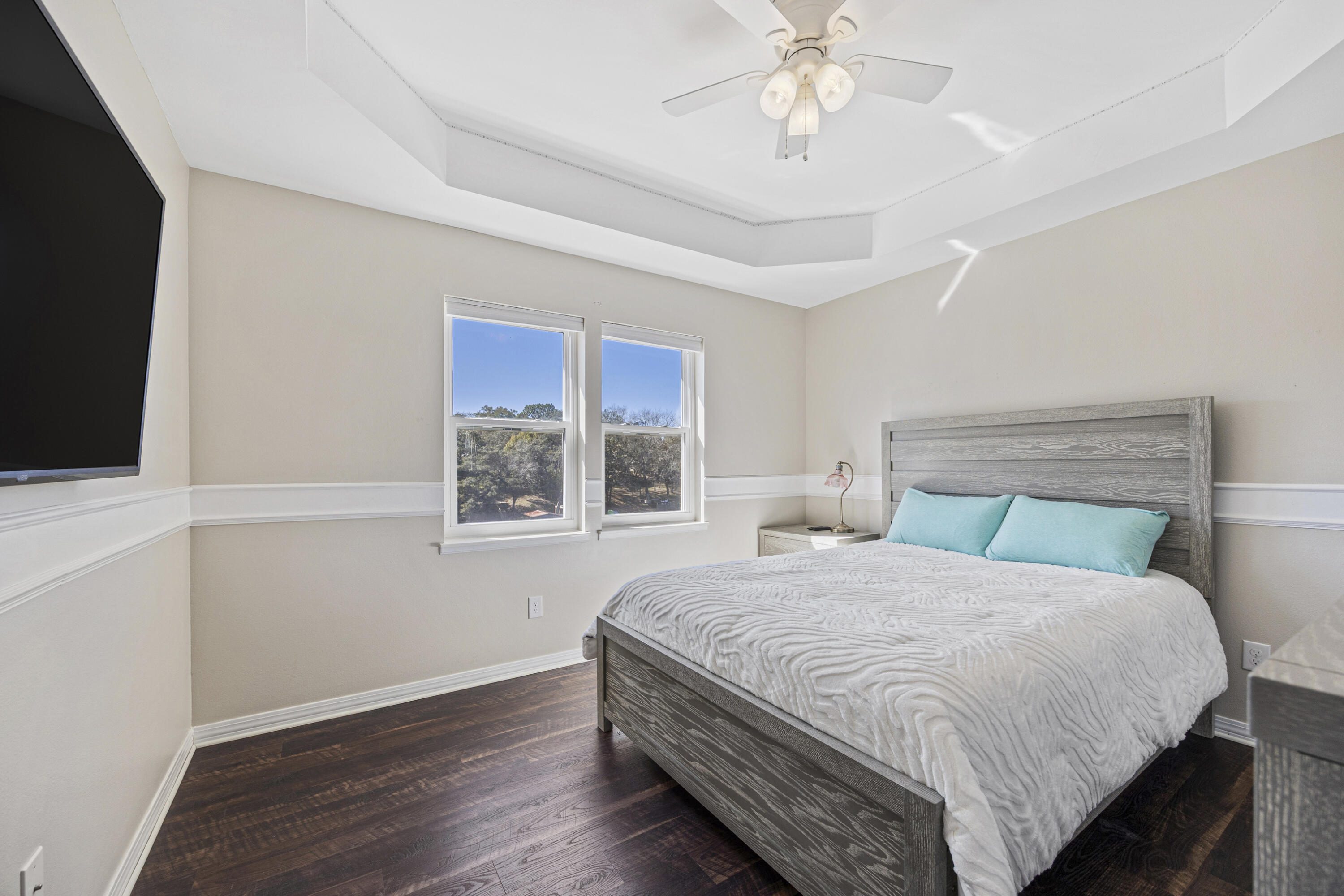 147 Eldredge Road Fort Walton Beach, FL 32547 - Photo 36 of 82 a bedroom with a bed and a flat tv screen on the dresser