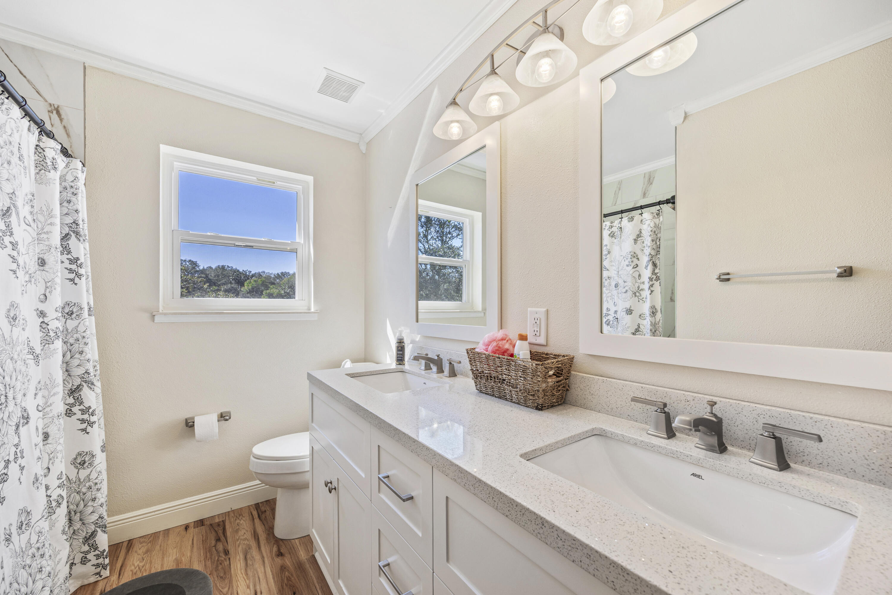 147 Eldredge Road Fort Walton Beach, FL 32547 - Photo 39 of 82 a bathroom with a double vanity sink mirror and toilet