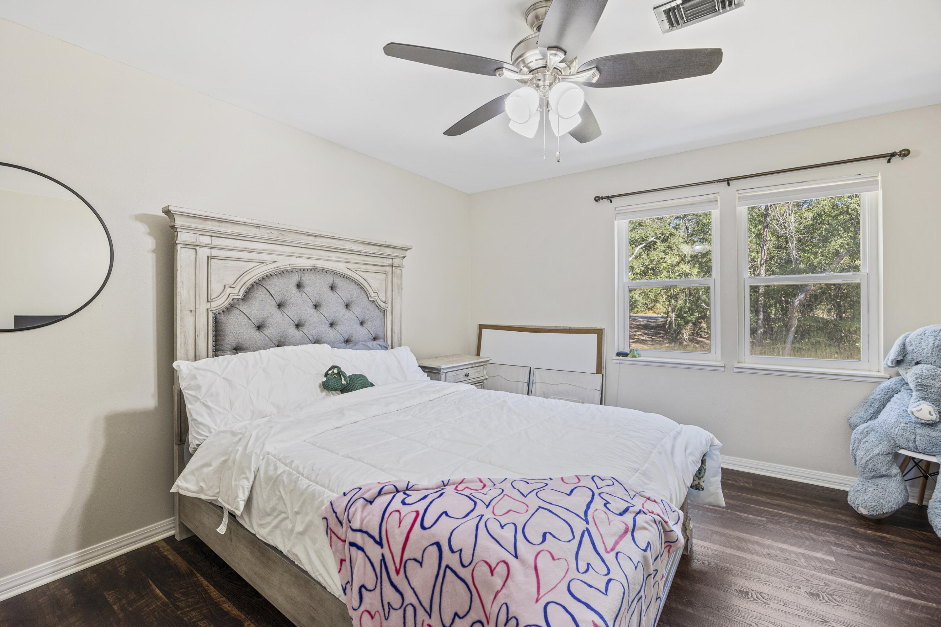 147 Eldredge Road Fort Walton Beach, FL 32547 - Photo 40 of 82 a bedroom with a large bed and a window