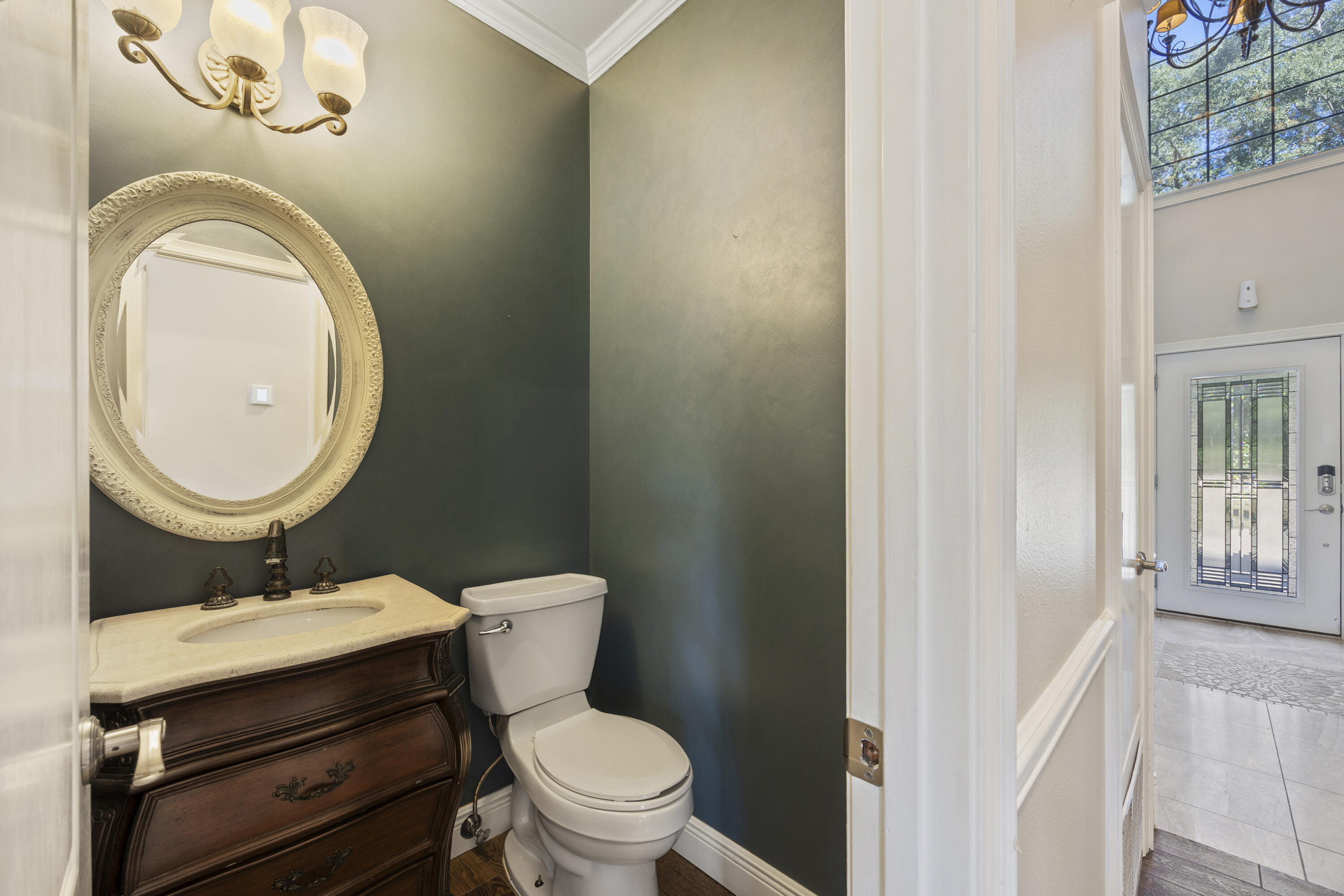147 Eldredge Road Fort Walton Beach, FL 32547 - Photo 42 of 82 a bathroom with a toilet a sink and a mirror