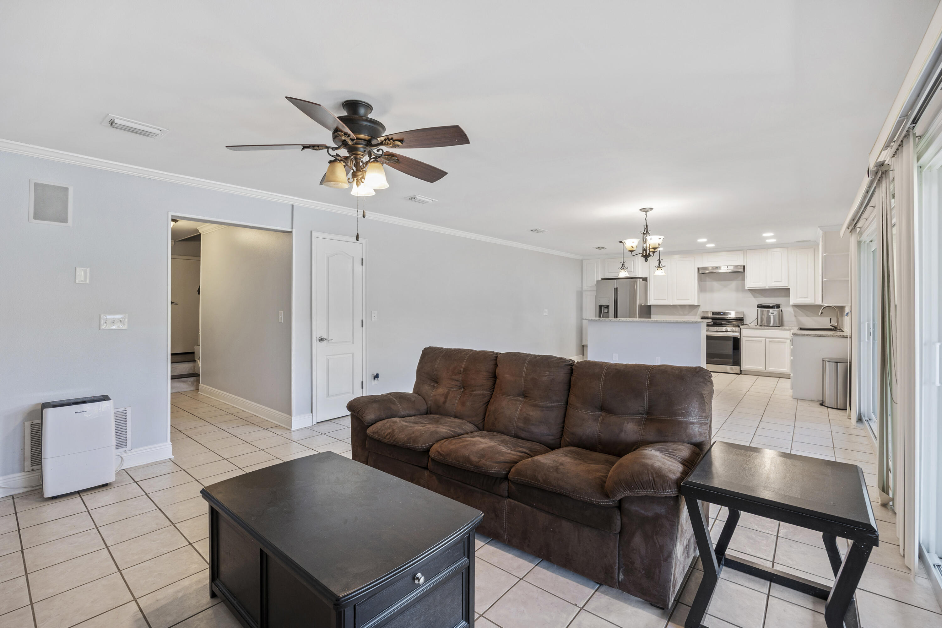 147 Eldredge Road Fort Walton Beach, FL 32547 - Photo 44 of 82 a living room with furniture and a dining table with wooden floor