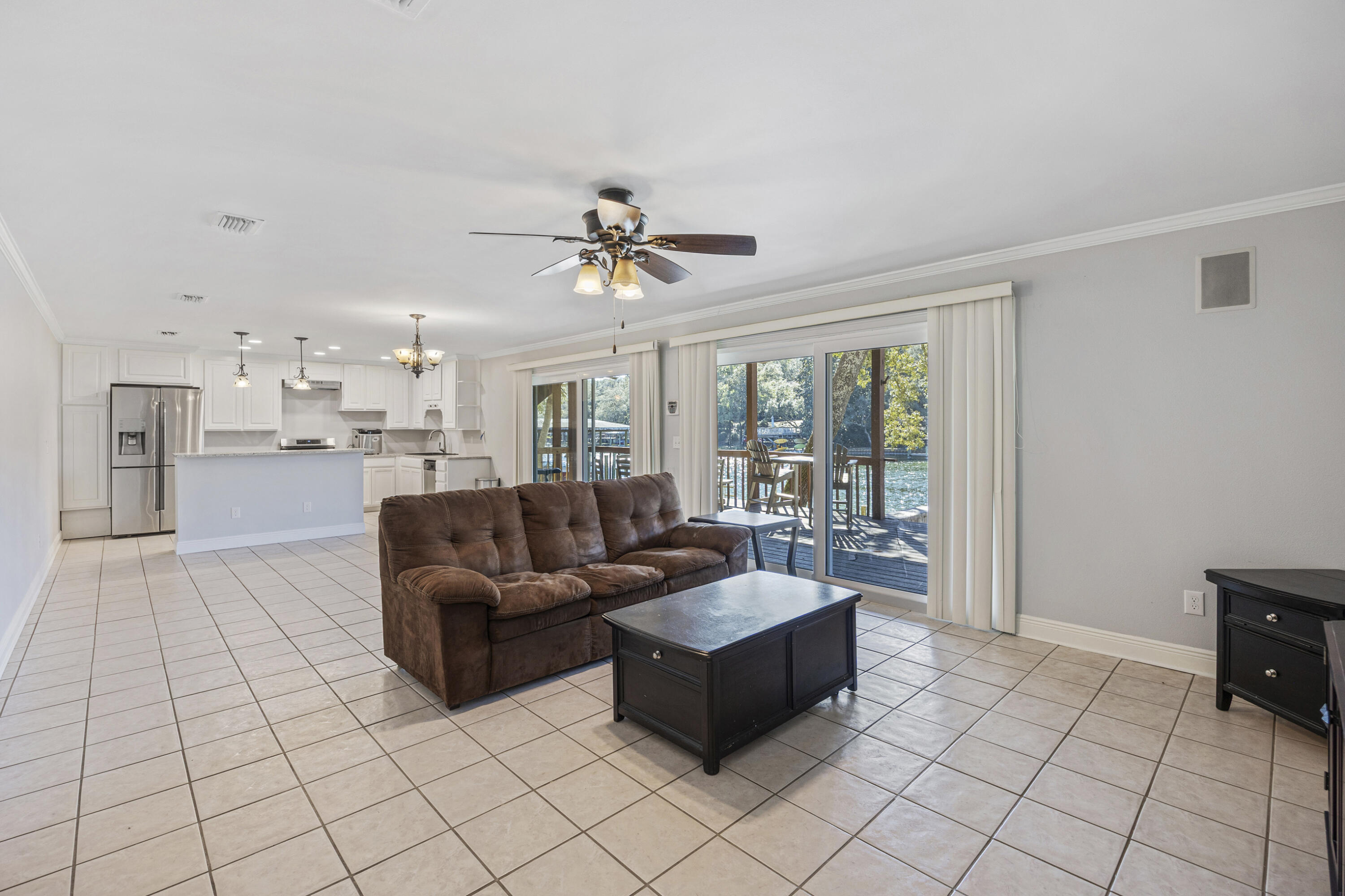 147 Eldredge Road Fort Walton Beach, FL 32547 - Photo 45 of 82 a living room with furniture and a chandelier