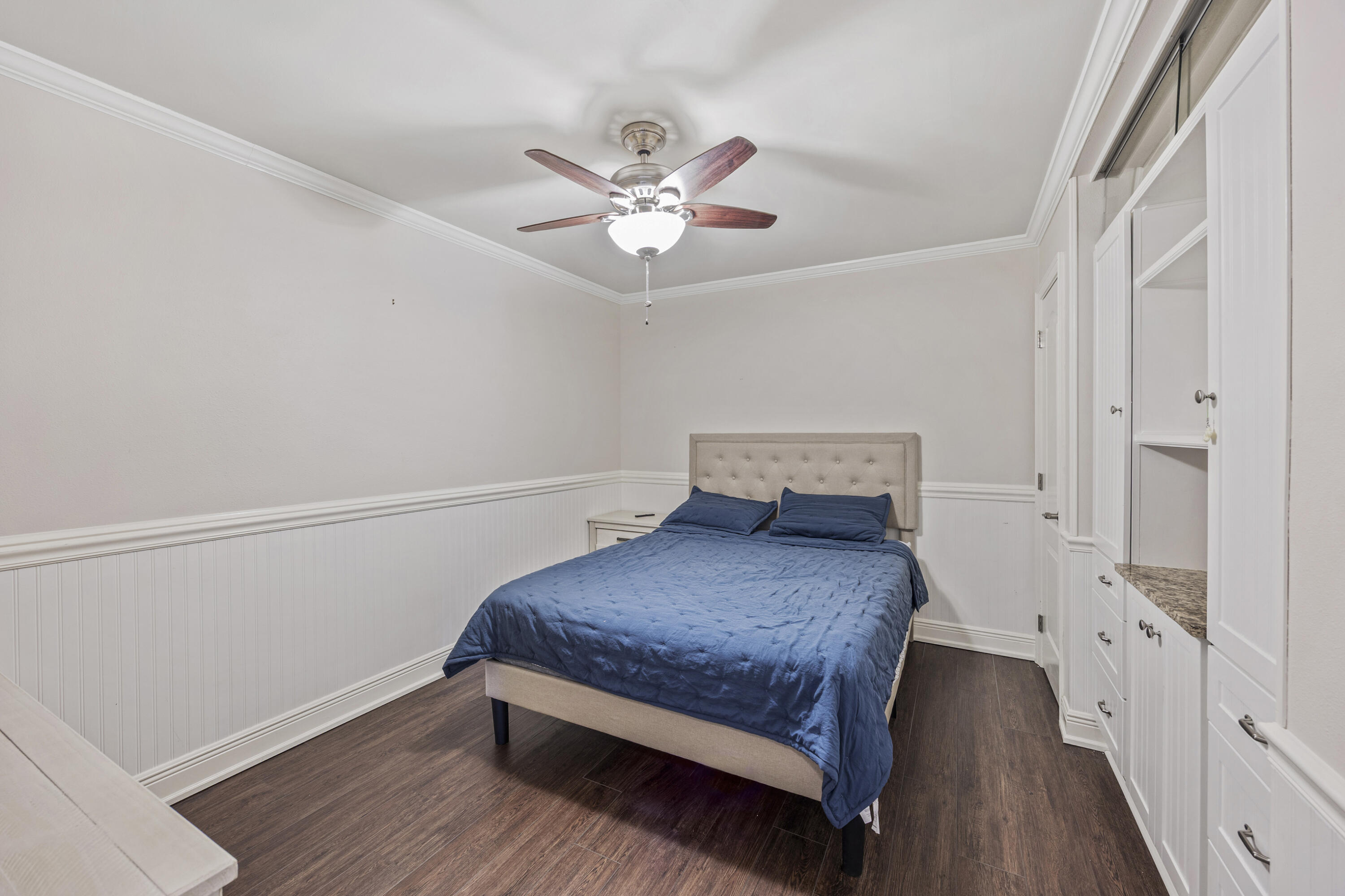 147 Eldredge Road Fort Walton Beach, FL 32547 - Photo 52 of 82 a bedroom with a bed and a chandelier