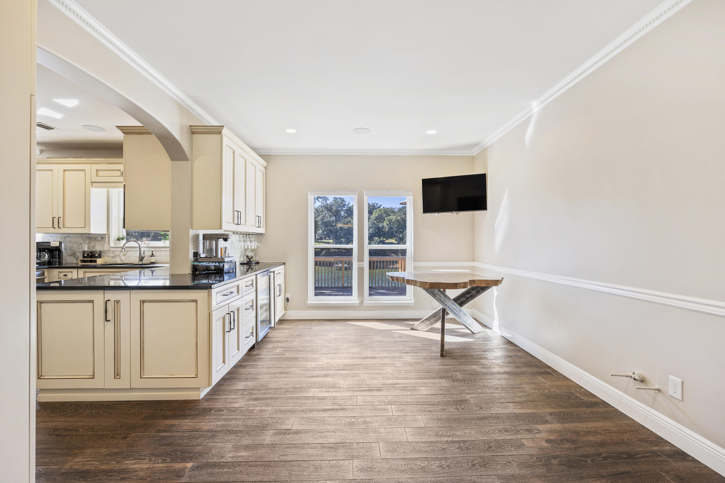 147 Eldredge Road Fort Walton Beach, FL 32547 - Photo 9 of 82 a open kitchen with granite countertop a stove top oven a sink a counter space and wooden floor