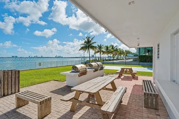 a view of swimming pool with lounge chairs