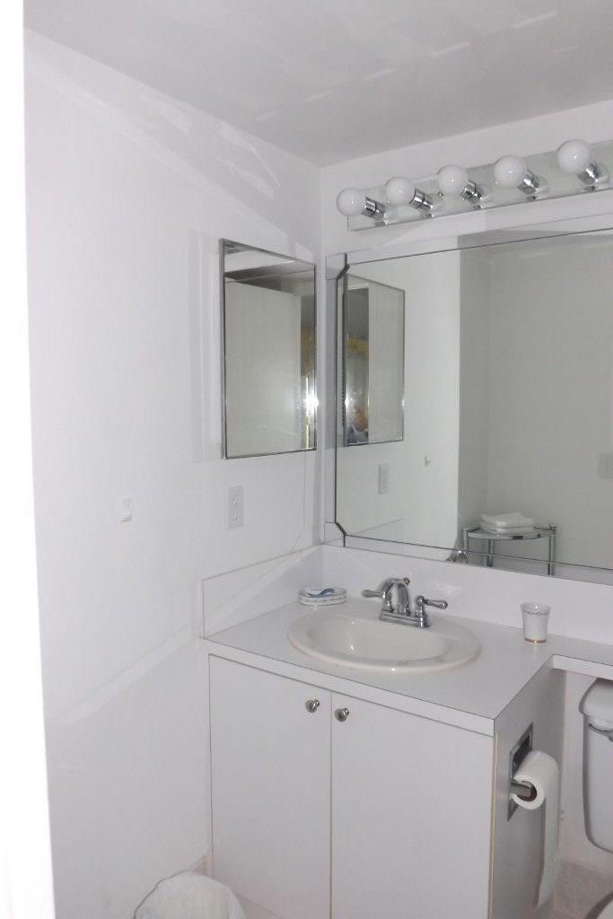4014 Cornwall East, Unit 4014 Boca Raton, FL 33434 - Photo 15 of 67 a bathroom with a sink and a mirror