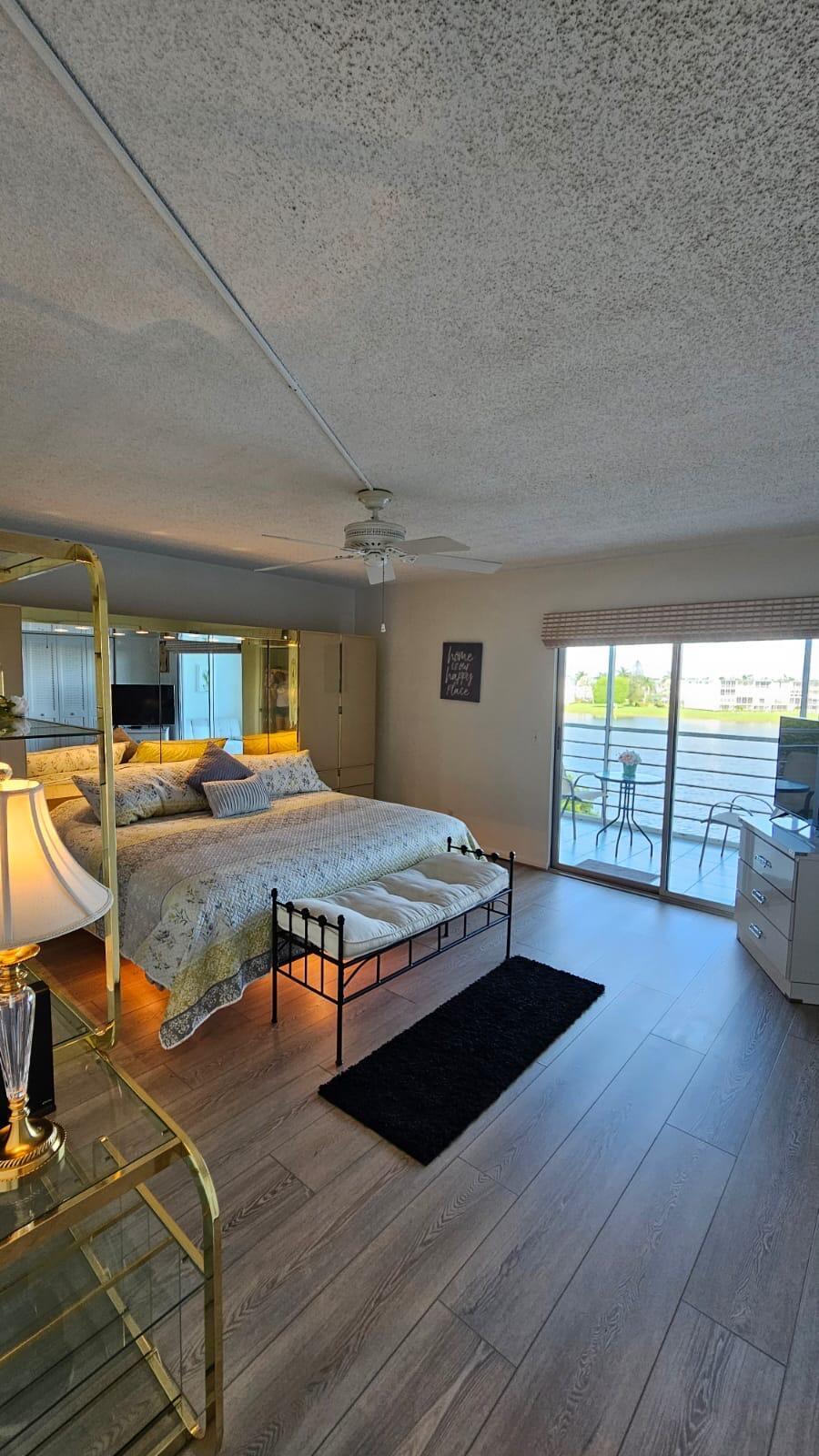4014 Cornwall East, Unit 4014 Boca Raton, FL 33434 - Photo 19 of 67 a bedroom with furniture and window