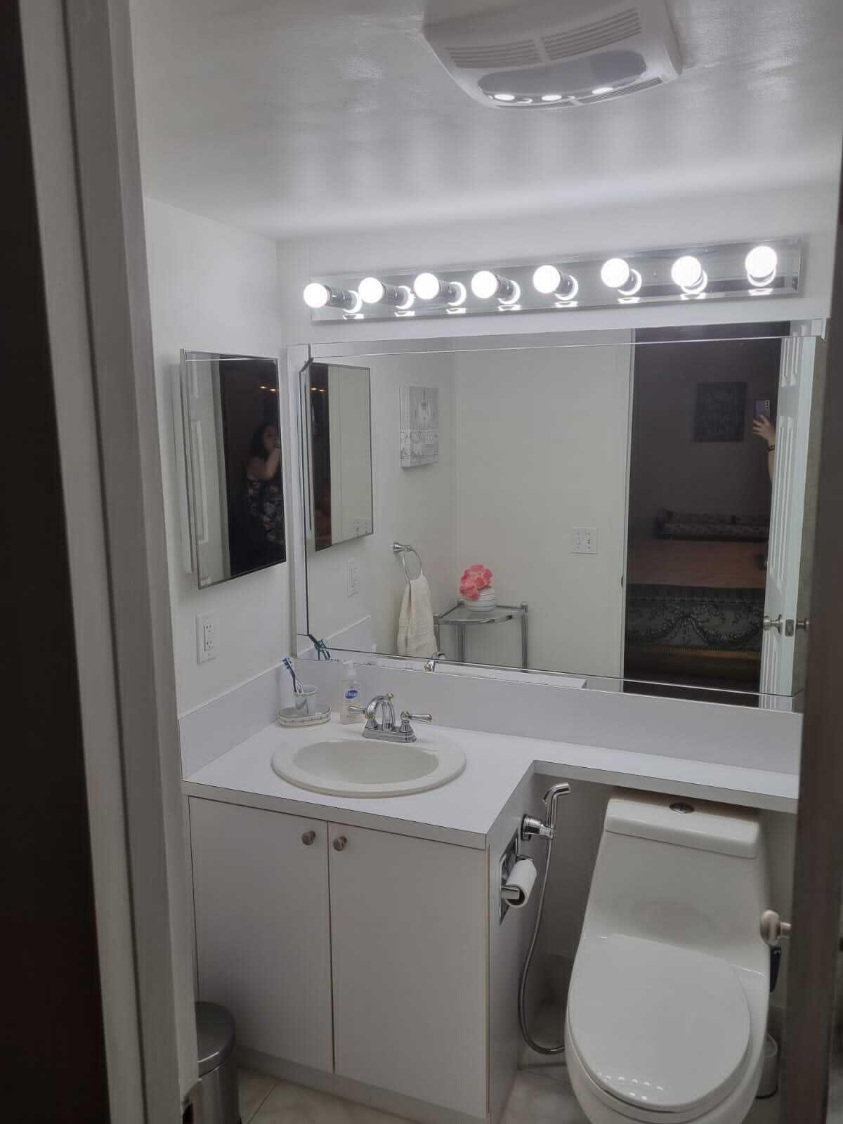 4014 Cornwall East, Unit 4014 Boca Raton, FL 33434 - Photo 20 of 67 a bathroom with a toilet sink and mirror