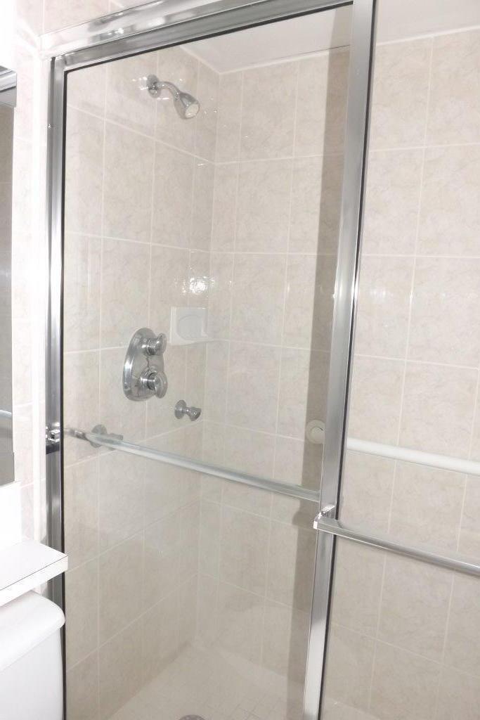 4014 Cornwall East, Unit 4014 Boca Raton, FL 33434 - Photo 21 of 67 a bathroom with a glass shower door