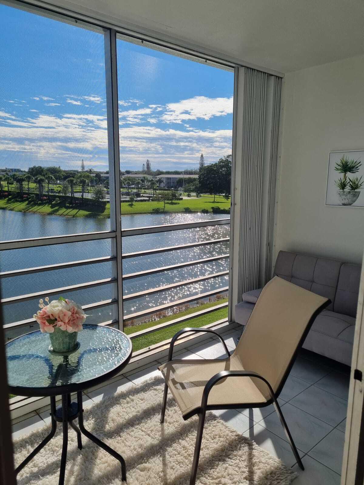 4014 Cornwall East, Unit 4014 Boca Raton, FL 33434 - Photo 24 of 67 a room with a table and chairs