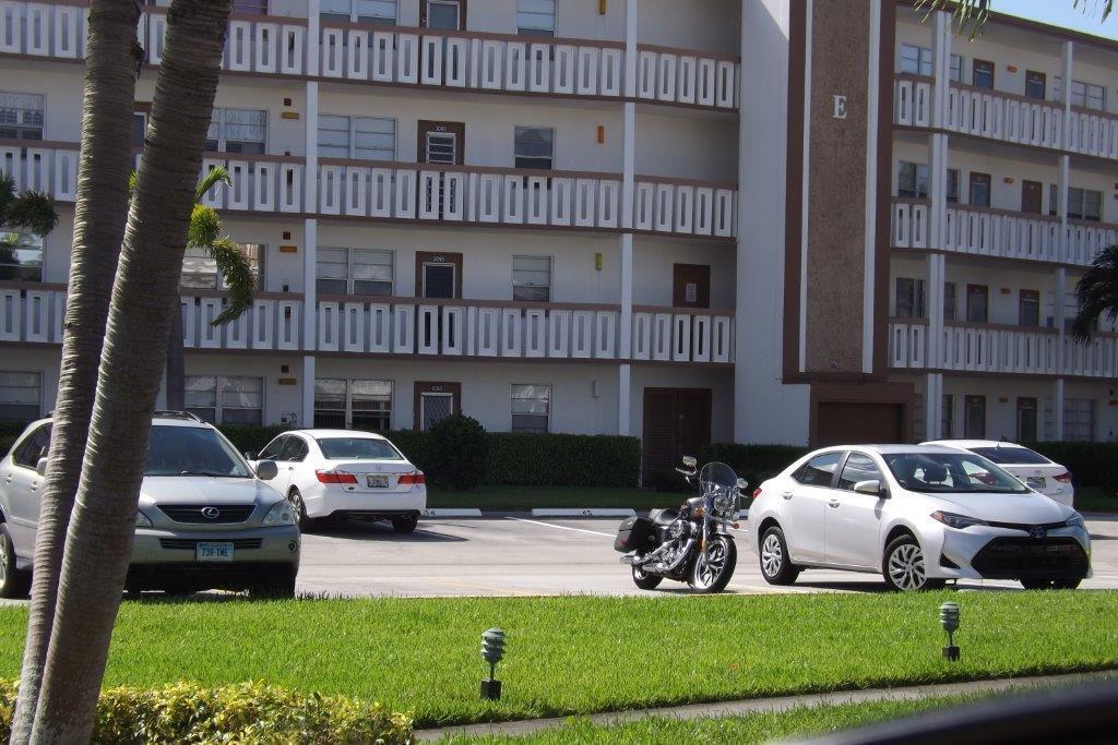 4014 Cornwall East, Unit 4014 Boca Raton, FL 33434 - Photo 28 of 67 a front view of a house with a garden and parking space