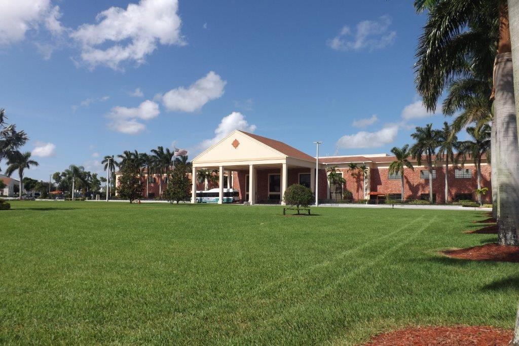 4014 Cornwall East, Unit 4014 Boca Raton, FL 33434 - Photo 29 of 67 a front view of a house with a yard