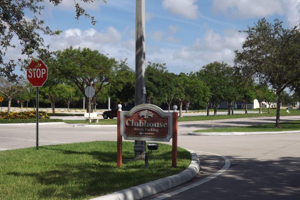 4014 Cornwall East, Unit 4014 Boca Raton, FL 33434 - Photo 57 of 67 a view of a park with swings and slides