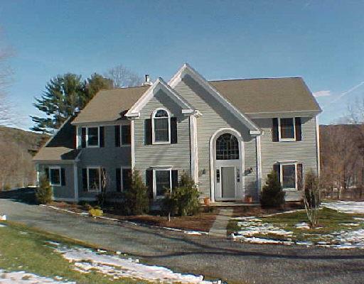74 River Ford Road Brookfield, CT 06804 - Photo 1 of 1 a front view of a house with garage and parking