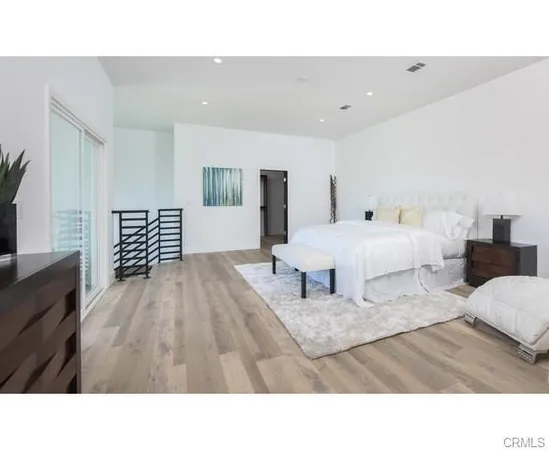 a en suite bathroom with a sink double vanity and a mirror