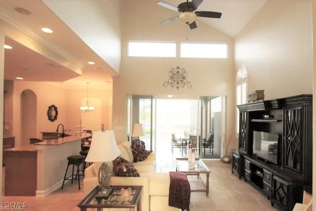a living room with fireplace furniture and a flat screen tv