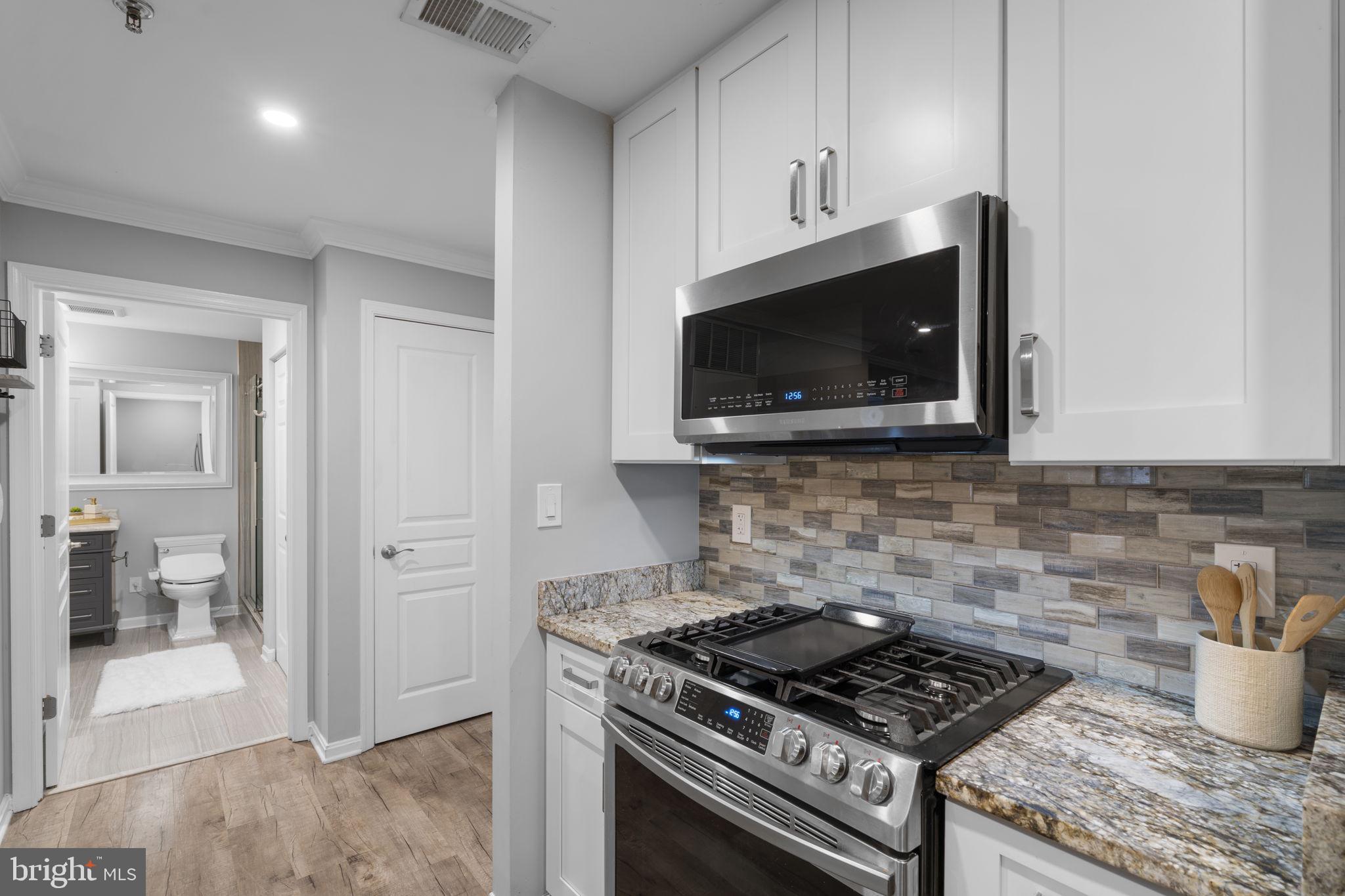 5575 Seminary Road, Unit 102 Falls Church, VA 22041 - Photo 15 of 31 a kitchen with a stove and a microwave