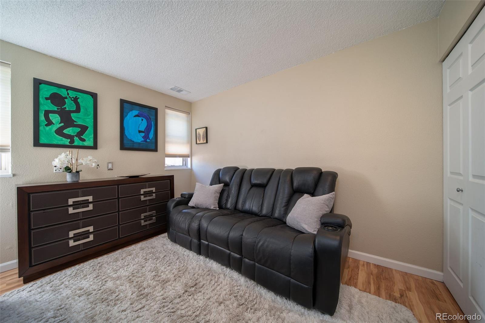 3375 Chisholm Trail, Unit A102 Boulder, CO 80301 - Photo 14 of 40 a living room with furniture and a flat screen tv
