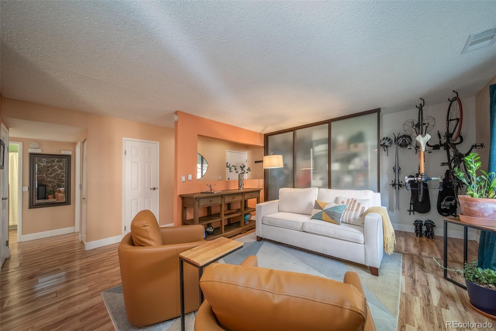 3375 Chisholm Trail, Unit A102 Boulder, CO 80301 - Photo 5 of 40 a living room with furniture and a large window