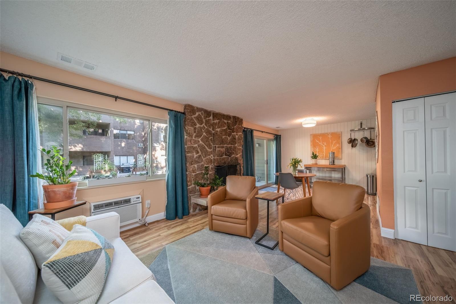 3375 Chisholm Trail, Unit A102 Boulder, CO 80301 - Photo 6 of 40 a living room with furniture and a large window