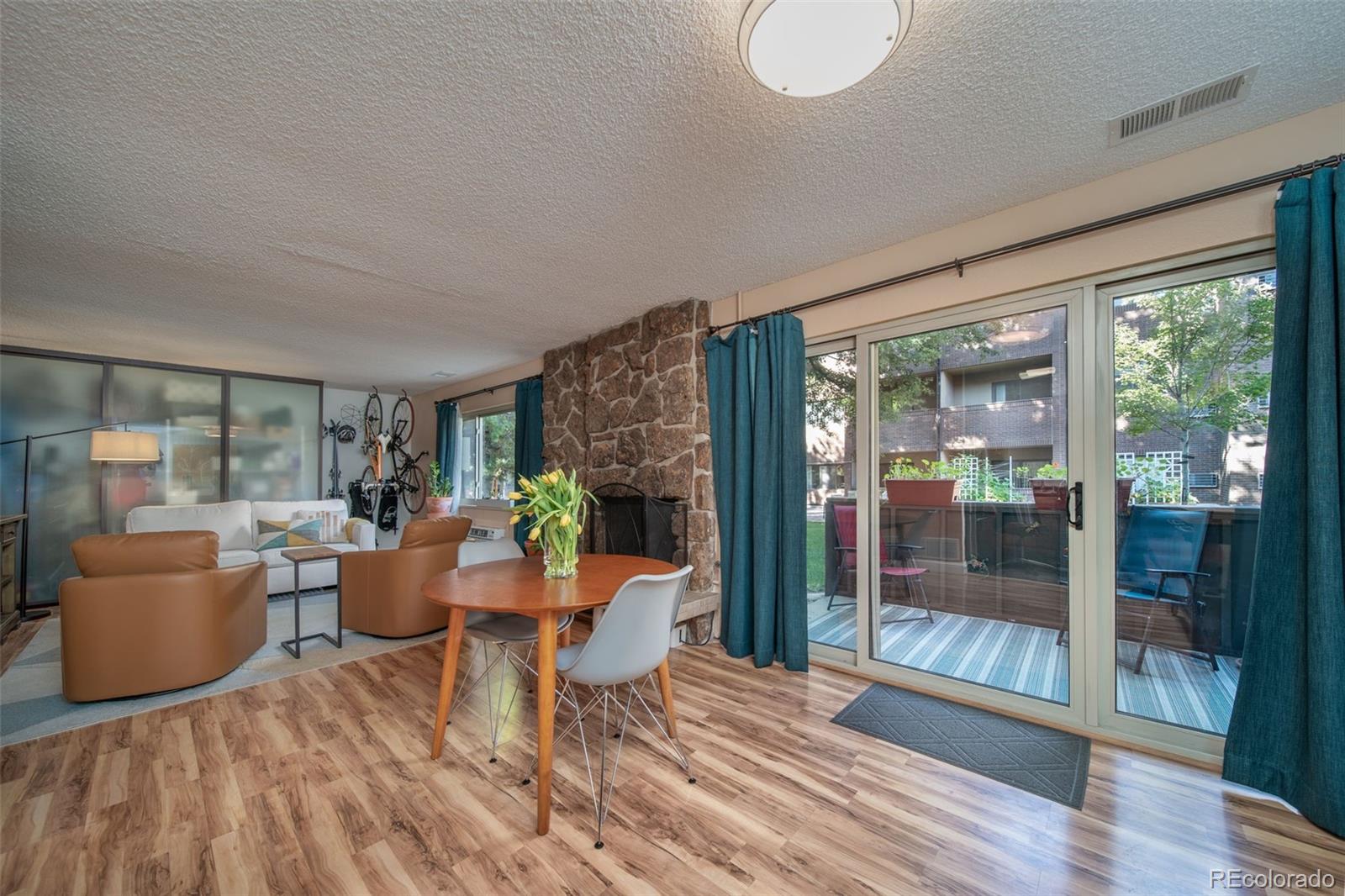 3375 Chisholm Trail, Unit A102 Boulder, CO 80301 - Photo 9 of 40 a living room with furniture and a wooden floor