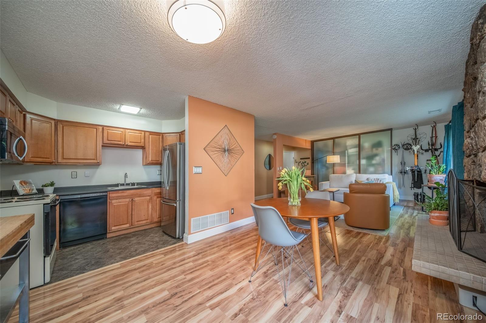3375 Chisholm Trail, Unit A102 Boulder, CO 80301 - Photo 10 of 40 a living room with furniture and a wooden floor
