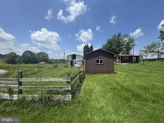 a view of a house with a big yard