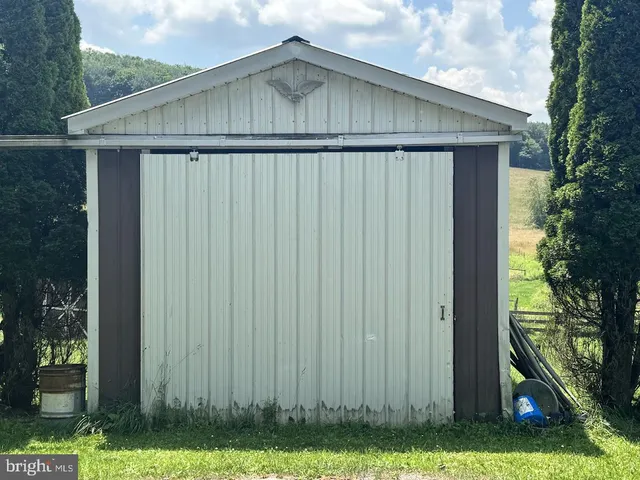 a view of a golf course with an ocean