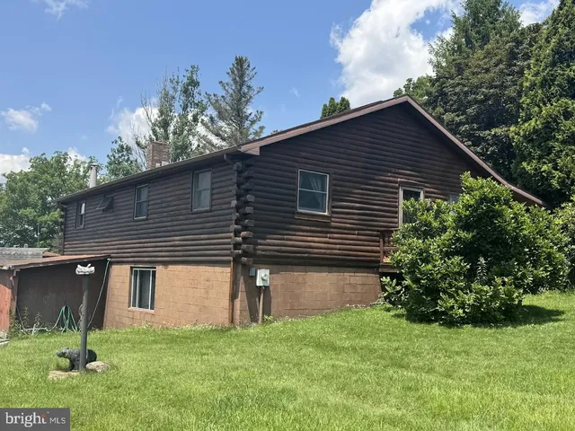 a backyard of a house with lots of green space