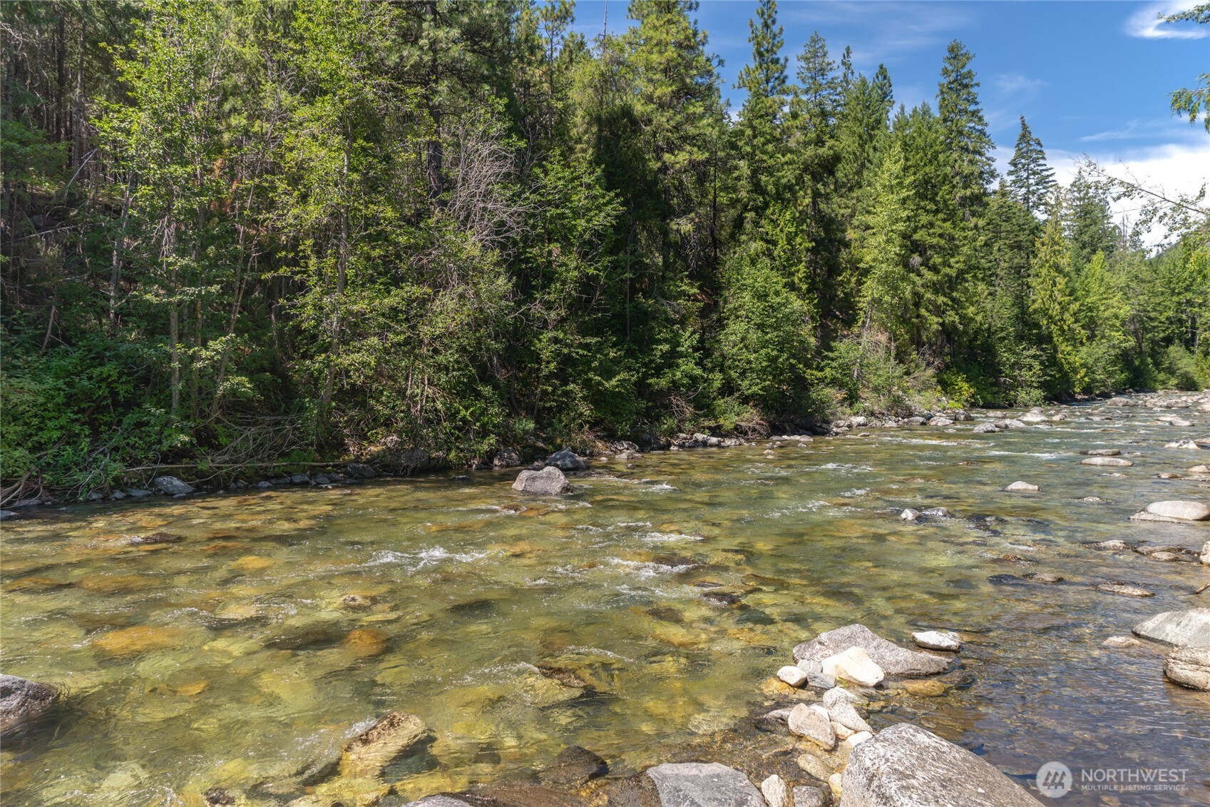 17976 Entiat River Road Entiat, WA 98822 - Photo 13 of 40 a view of a yard with a tree