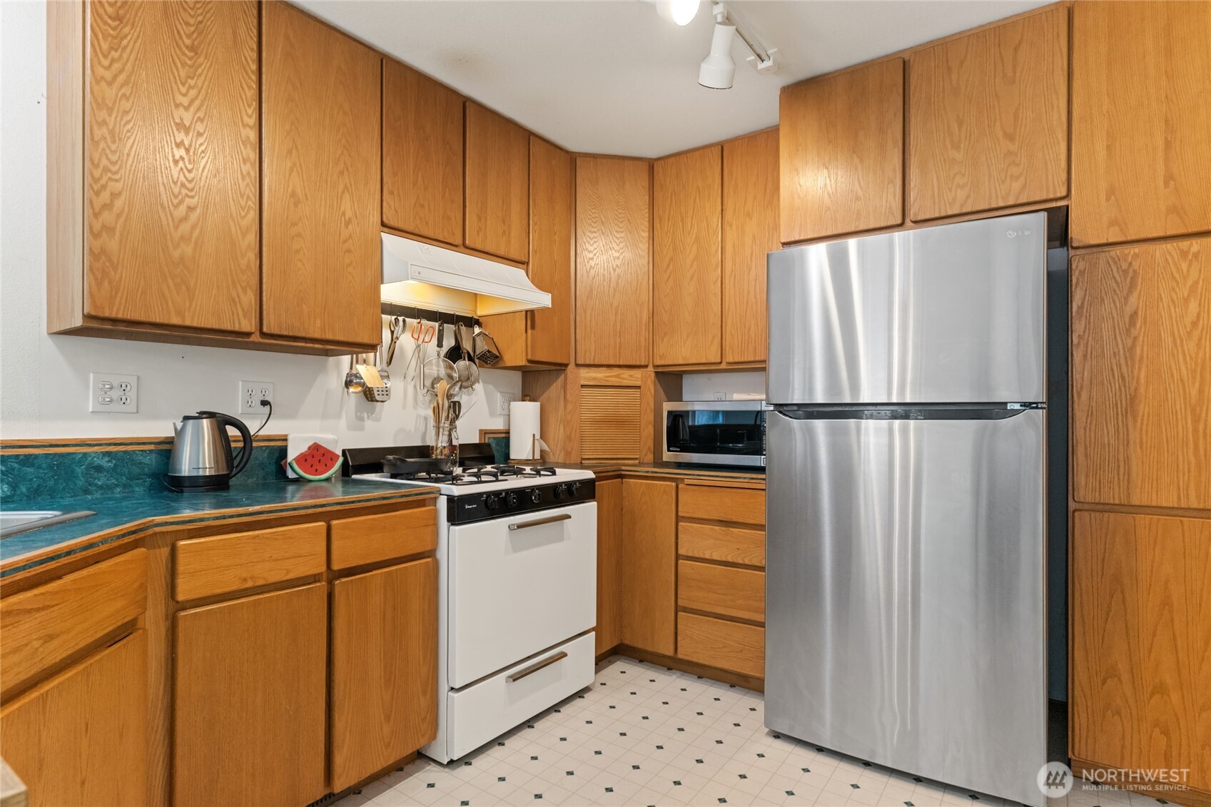 17976 Entiat River Road Entiat, WA 98822 - Photo 25 of 40 a kitchen with stainless steel appliances granite countertop a refrigerator sink and cabinets